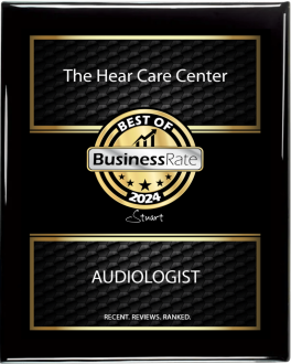 Best of Business Rate 2024 A plaque reading The Hear Care Center - Best of Business Rate 2024 - Stuart - Audiologist. Recent hearing loss reviews. Ranked. Features a gold and black design.